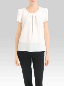 A simple white blouse like this one from Simons is perfect for any style of skirt, shorts or trousers.